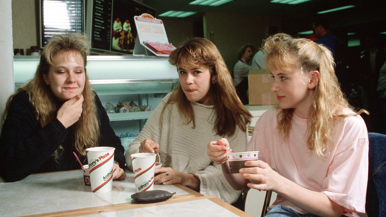 Teenagers enjoying ice cream at a food court in 1990