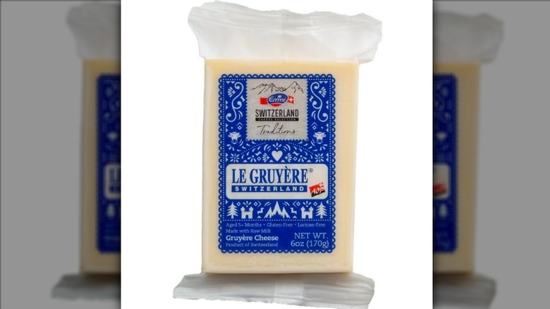 A package of Emmi Le Gruyère cheese on a white background.