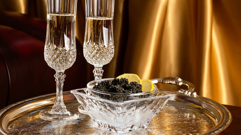 Champagne and caviar on a silver tray