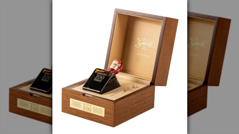 bottle of Giusti Reserve 100 balsamic in a wooden presentation box