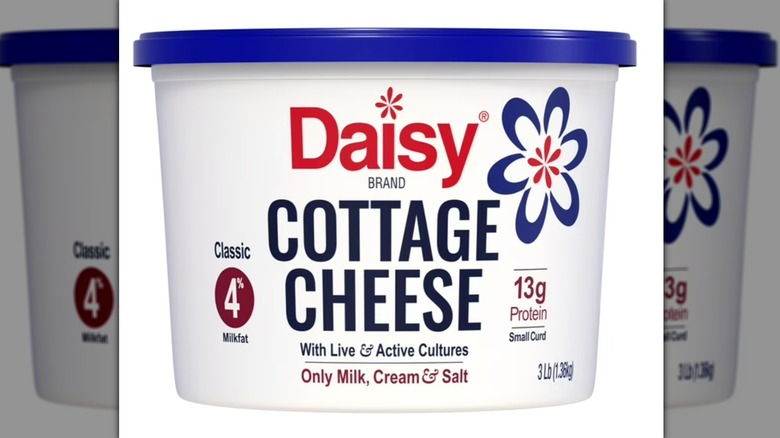 Container of Daisy Cottage Cheese on a white background.