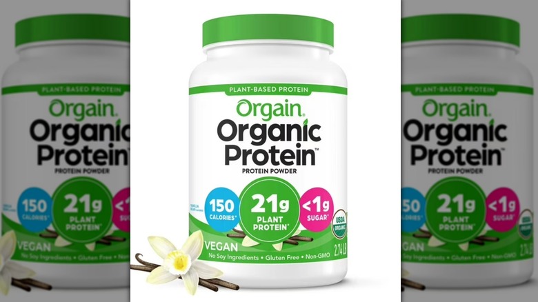 Container of vanilla-flavored Orgain Organic Plant-Based Protein Powder on a white background.