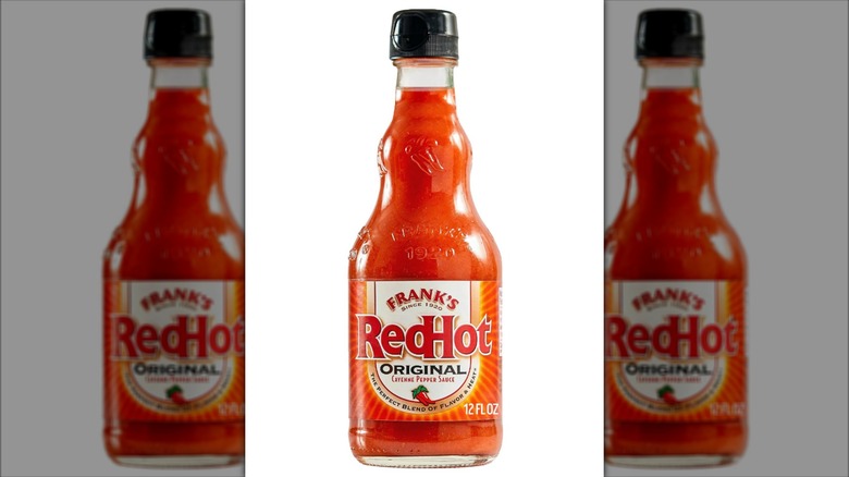A bottle of Frank's RedHot on white background