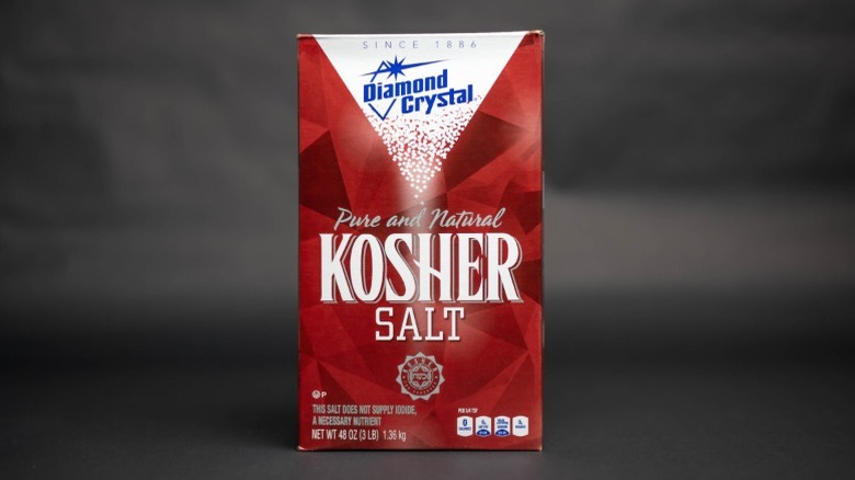 A box of Diamond Crystal kosher salt on a gray background