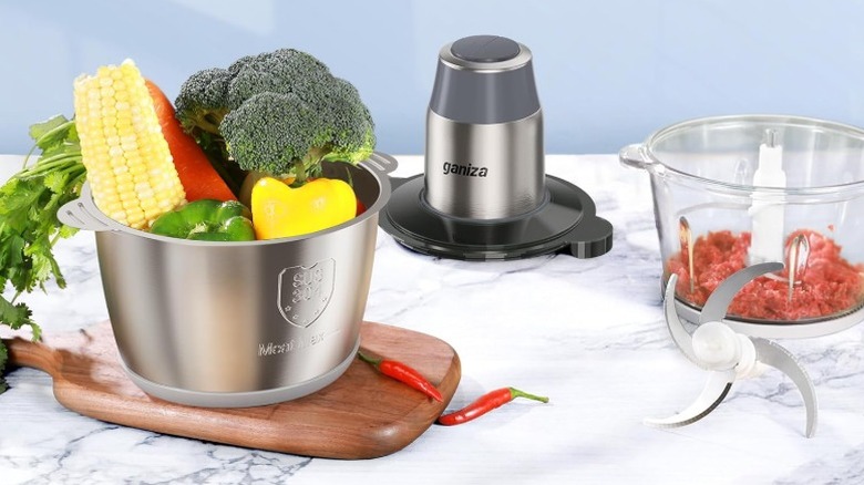 Gray Ganiza food processor with one bowl holding vegetables and the other holding meat