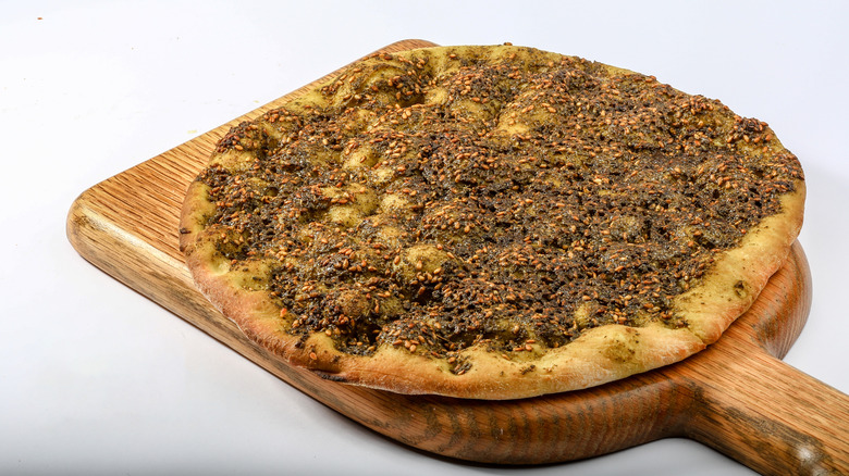 Manakish on a wooden cutting board