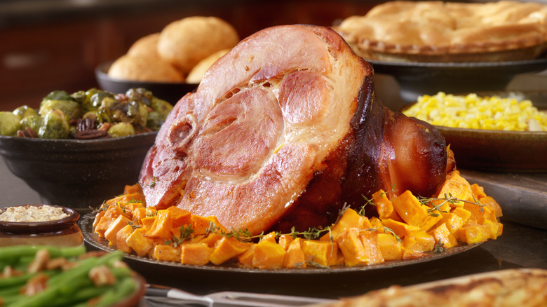 Ham surrounded by squash