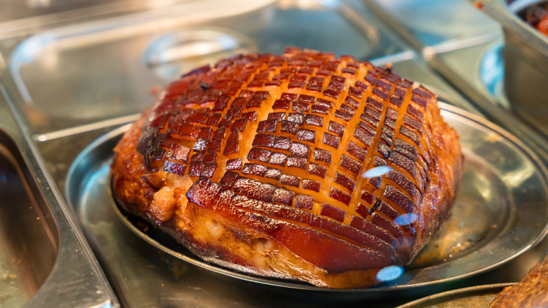 Scored ham on tray
