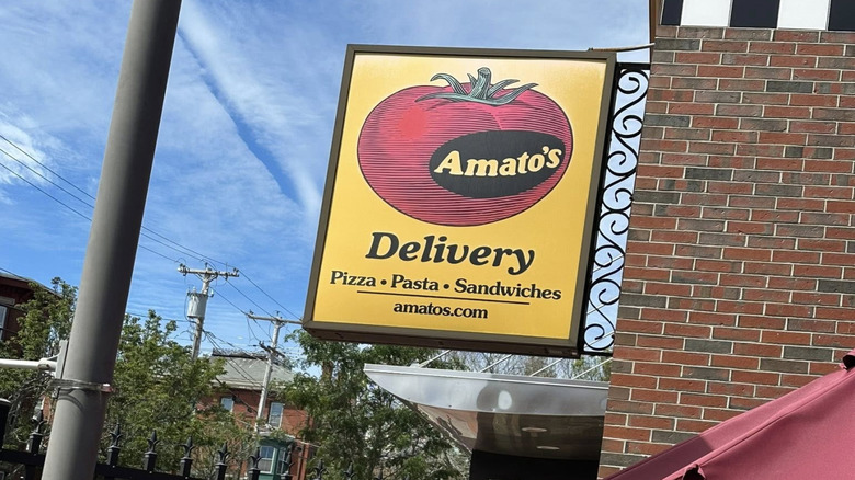 Sign hanging on the exterior of an Amato's restaurant