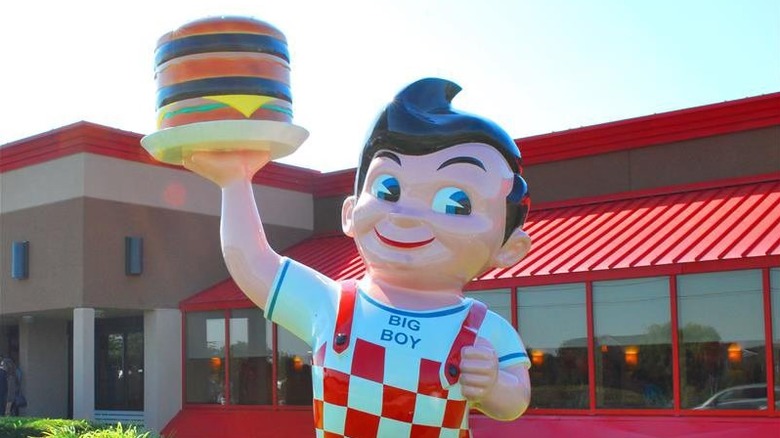 Big Boy mascot in front of a Big Boy restaurant in broad daylight