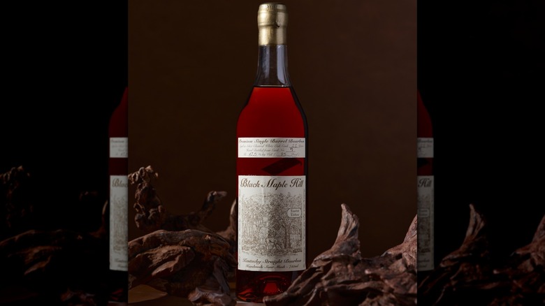 Bottle of Black Maple Hill 16-year-old on dark background