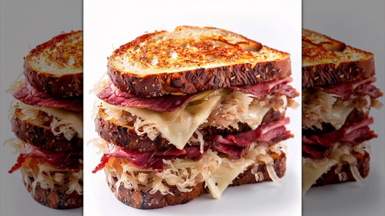 A Reuben sandwich on a white background, mirrored