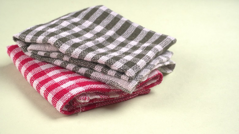 two folded checkered dish rags