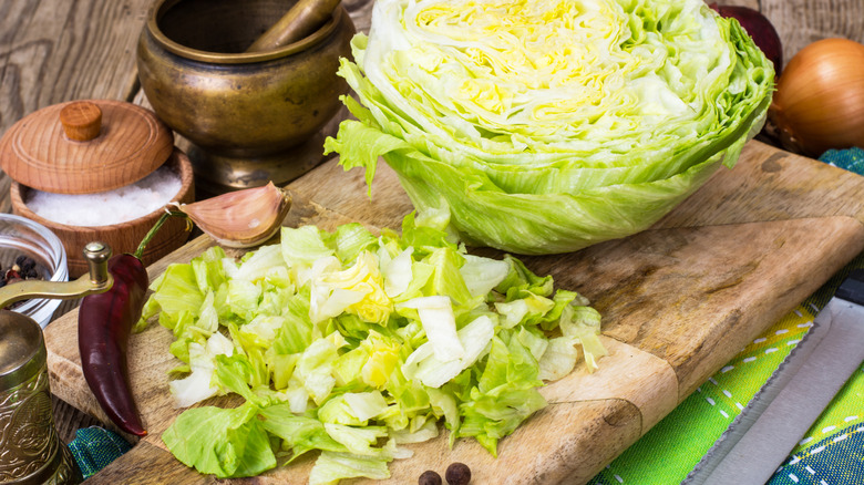 Half of a head of iceberg lettuce, whole and chopped