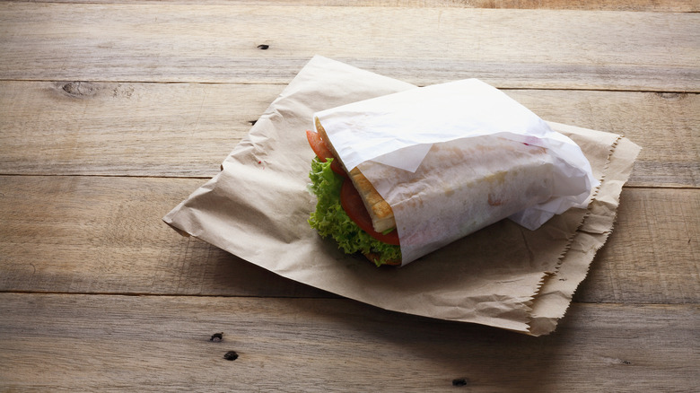 A sandwich wrapped in wax paper