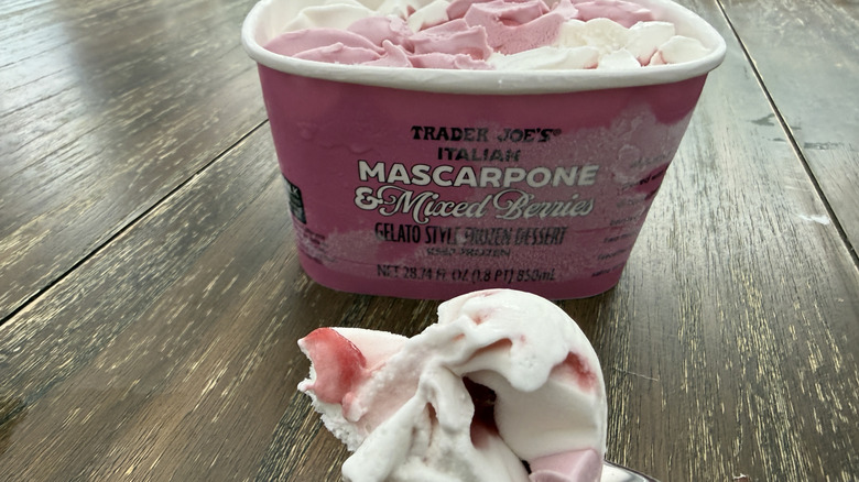 Carton and scoop of Trader Joe's Italian Mascarpone and Mixed Berries on wooden table