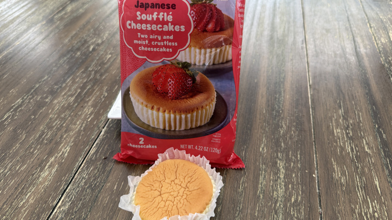 Trader Joe's Japanese soufflé cheesecakes package and an unwrapped one on a wooden table