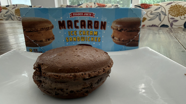 Box and plate of unwrapped Trader Joe's Macaron Ice Cream Sandwiches on wooden table
