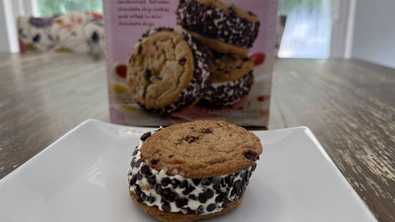 Trader Joe's Sublime Ice Cream Sandwiches package and one on a square, white plate on a wooden table
