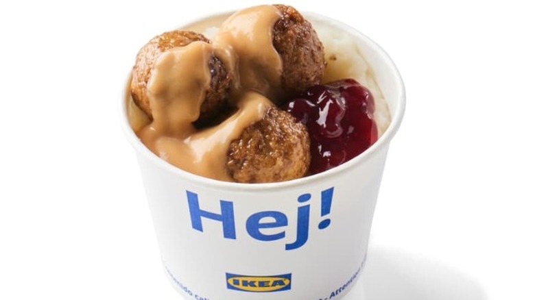 paper cup of mashed potatoes, meatballs, gravy, and lingonberry jam from the Ikea Swedish Bistro