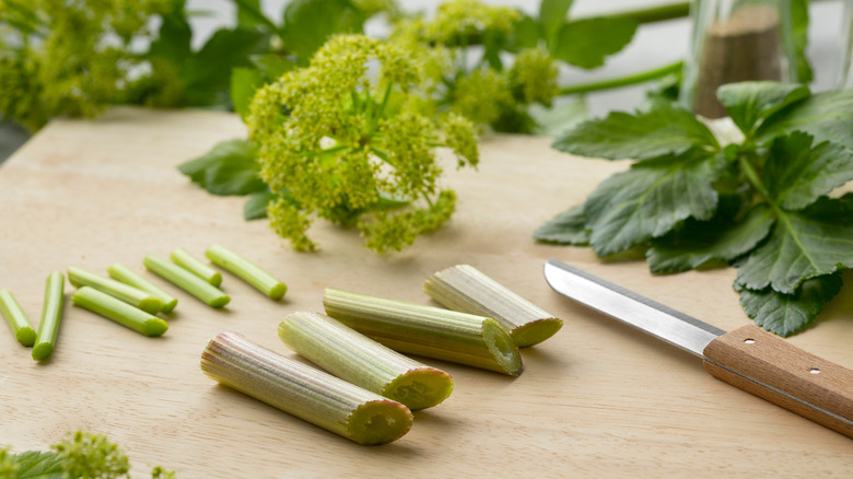 Alexanders plant being prepared on a cutting board
