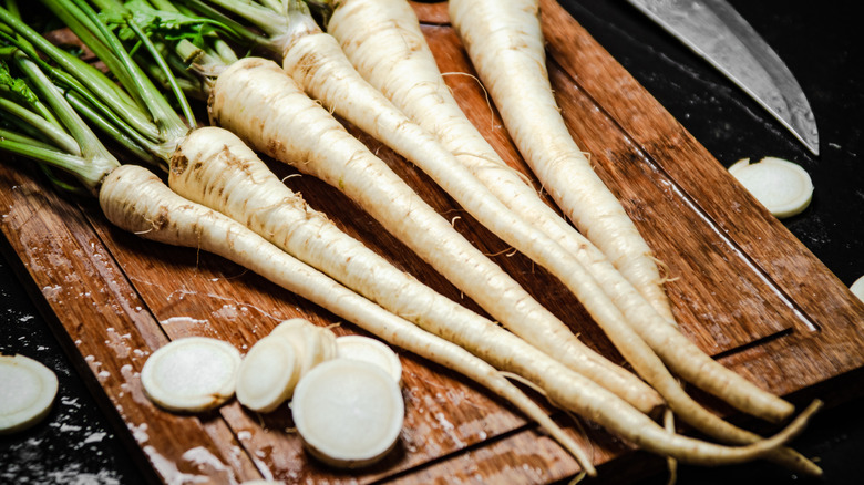 Parsley roots displayed on a cutting board