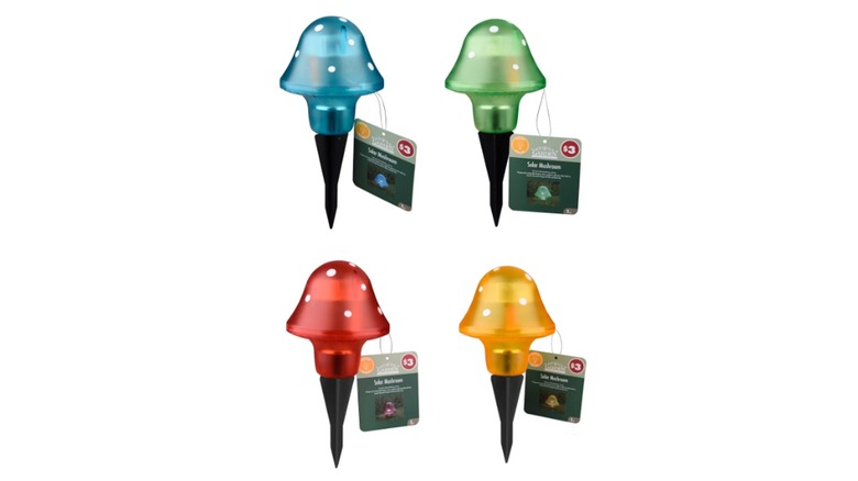 Four colorful mushroom lights in blue, green, orange, and red on a white background.