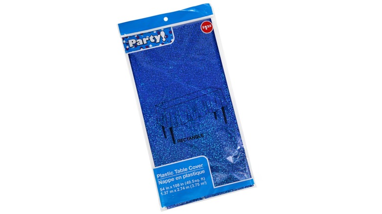 A shiny blue table cover in clear plastic packaging on a white background