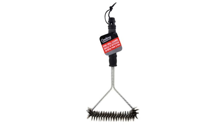 A wire grill cleaner on a white background.