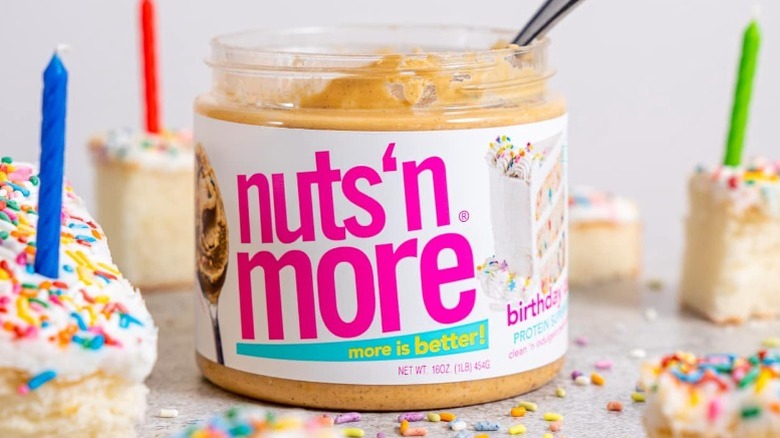 borthday cake-flavored Nuts 'N More peanut butter with slices of birthday cake