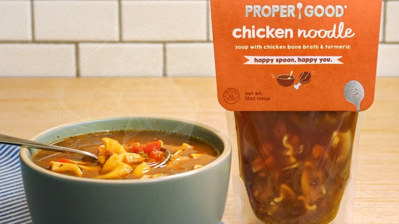 Proper Good chicken noodle soup in bowl and pouch