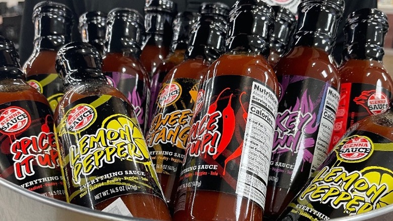 assorted Sienna Sauce bottles in a metal bucket