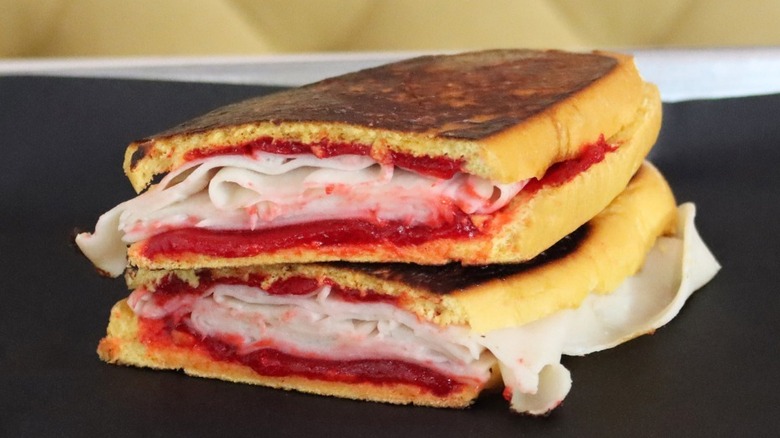 elena ruz sandwich on black table