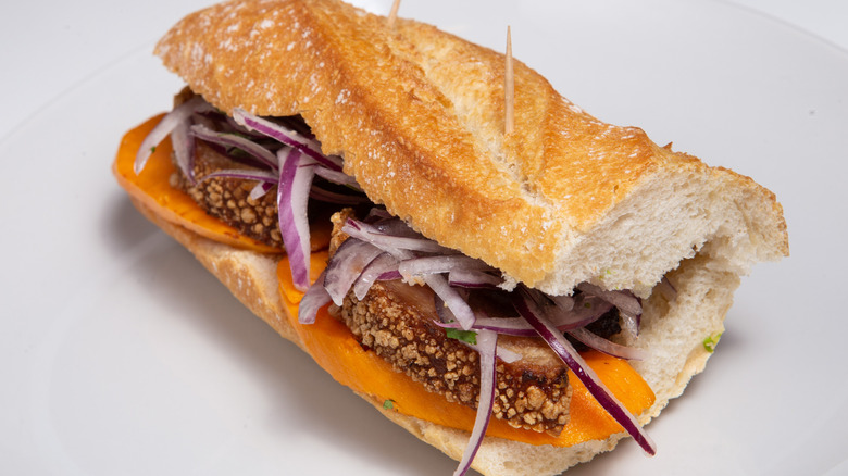 chicharron sandwich on white background