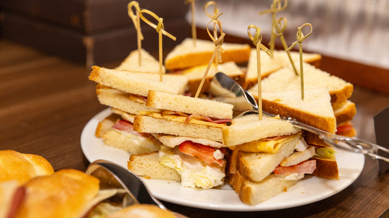 tramezzini sandwiches on plate with toothpicks