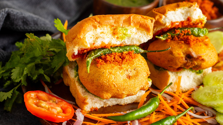 vada pav sandwiches decorated with herbs and veggies