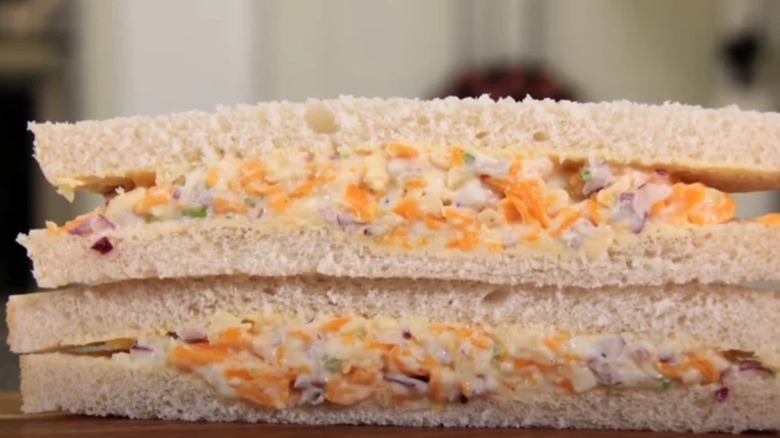 Close up of cheese and onion sandwich sliced in half