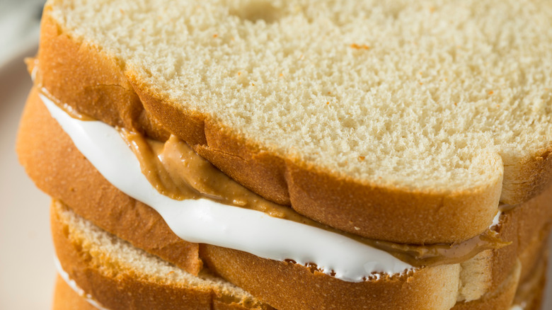 Close up of fluffernutter sandwich on white bread with peanut butter and marshmallow fluff