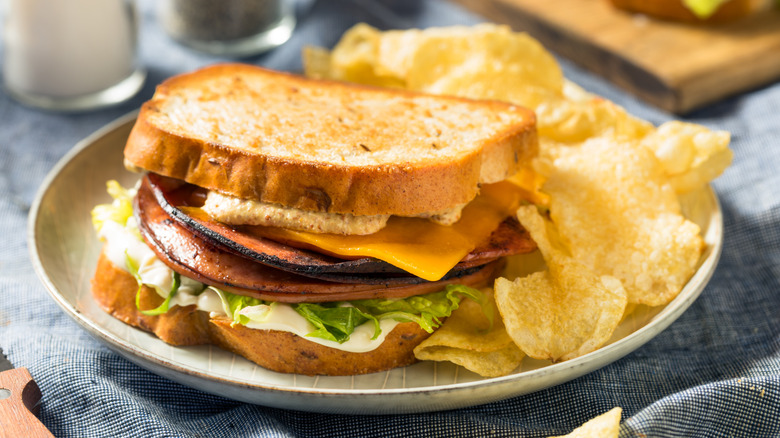Fried bologna sandwich with chips