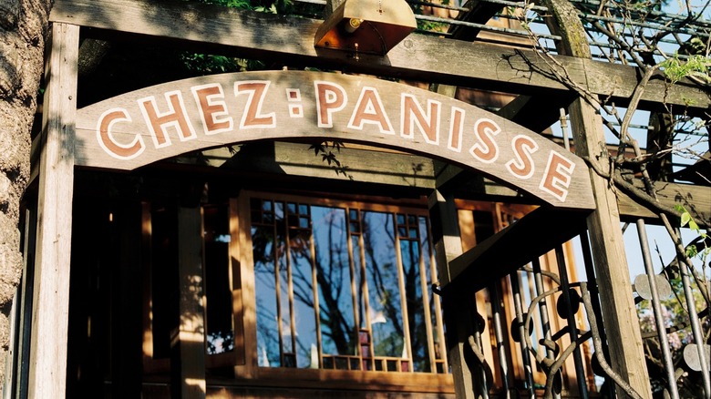 Wooden Chez Panisse sign outside restaurant entrance