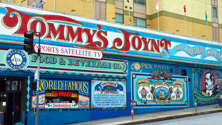 Tommy's Joynt entrance painted with carnival lettering mural