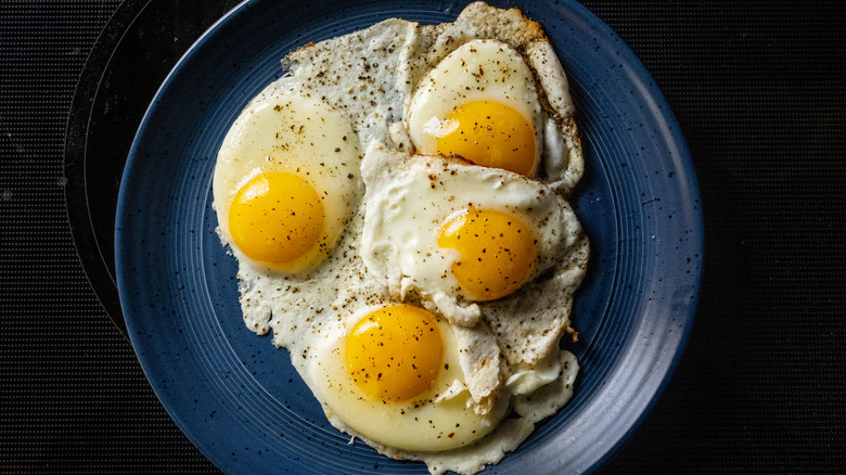 Fried eggs on a blue plate
