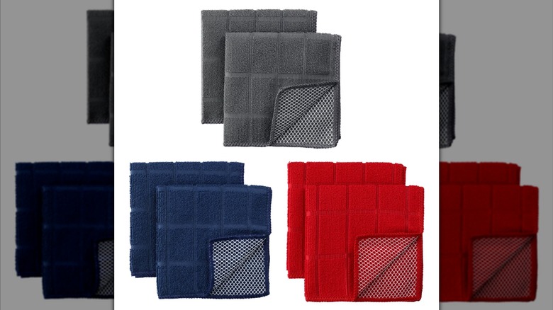 Three sets of Dollar Tree dish towels in blue, gray, and red
