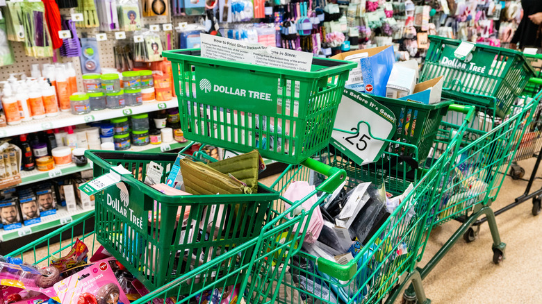 Dollar Tree shopping carts and baskets filled with merchandise in cosmetics aisle of Dollar Tree