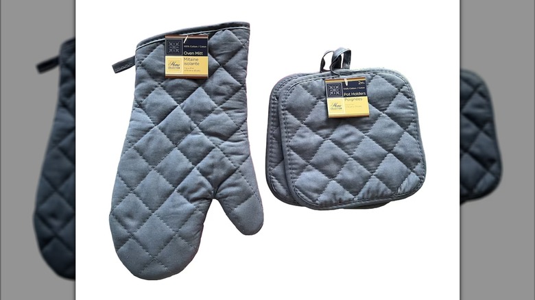 A set of blue Dollar Tree oven mitts and pot holders