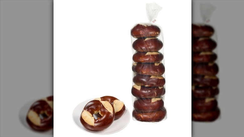 Kirkland Signature Pretzel Bagels in a bag and on a plate on a white background.