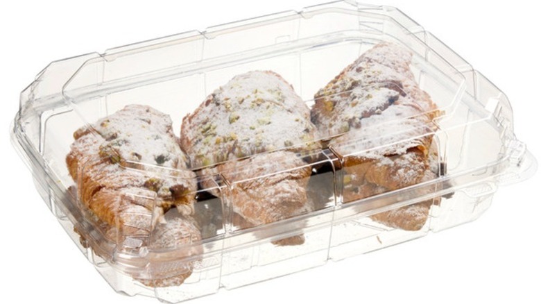 Kirkland Signature Twice Baked Pistachio Filled Croissants in clear plastic clamshell packaging on a white background.