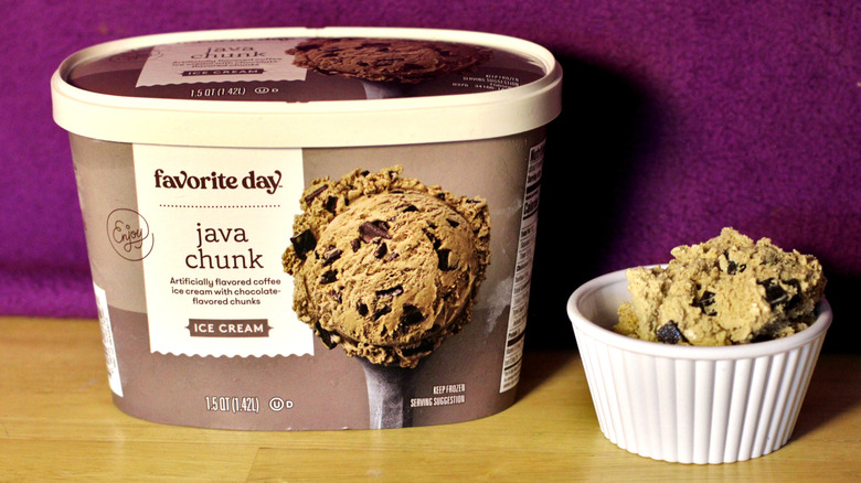 A container of Target's Favorite Day brand java chunk flavored ice cream beside a bowl of the scooped ice cream