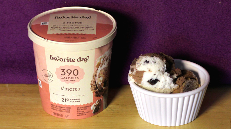 A container of Target's Favorite Day brand s'mores flavored ice cream beside a bowl of the scooped ice cream