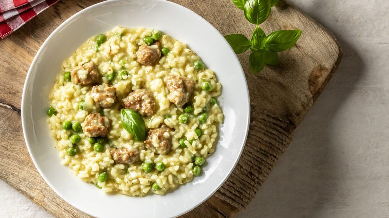 Bowl of risotto with meatballs and basil